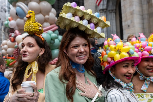 People dress in elaborate hats and costumes during the annual Easter Parade and Bonnet Festival outside of St. Patrick's Cathedral on Fifth Avenue on April 5, 2026 in New York City. (Photo by Spencer Platt/Getty Images)