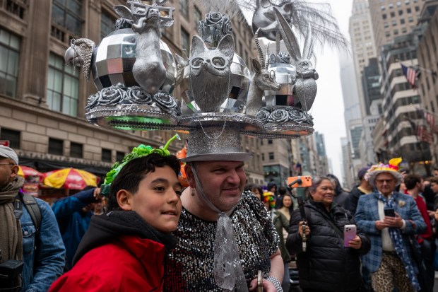 People dress in elaborate hats and costumes during the annual Easter Parade and Bonnet Festival outside of St. Patrick's Cathedral on Fifth Avenue on April 5, 2026 in New York City. (Photo by Spencer Platt/Getty Images)