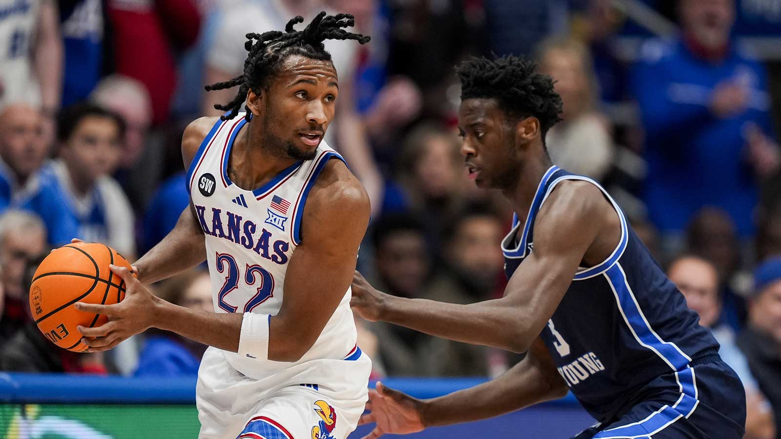 Kansas Jayhawks guard Darryn Peterson (22) looks to pass against BYU Cougars forward AJ Dybantsa (3) during the first half at Mizzou Arena.