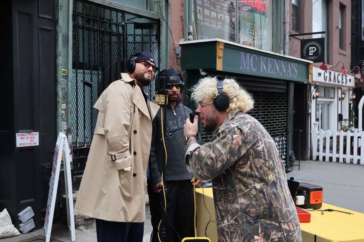 Michael Minelli interacts with someone on the streets of NYC.