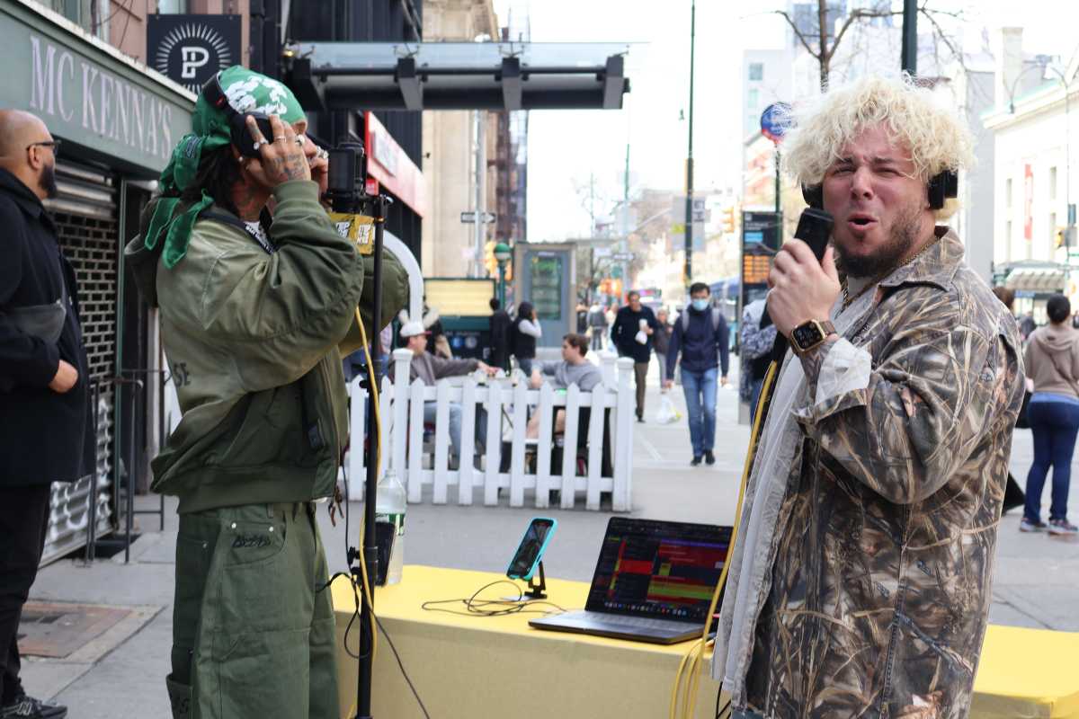 Michael Minelli interacts with someone on the streets of NYC.