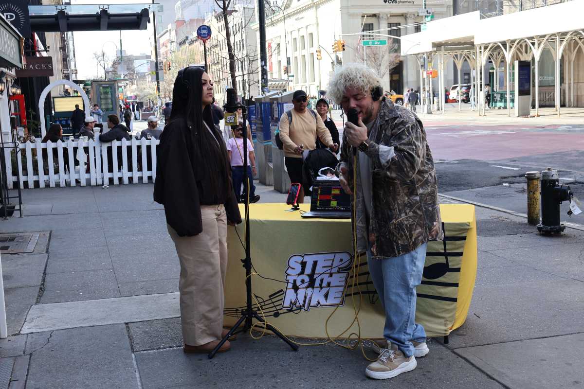 Michael Minelli interacts with someone on the streets of NYC.