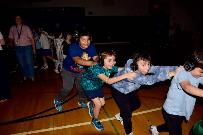 Students dance at the school's silent disco.