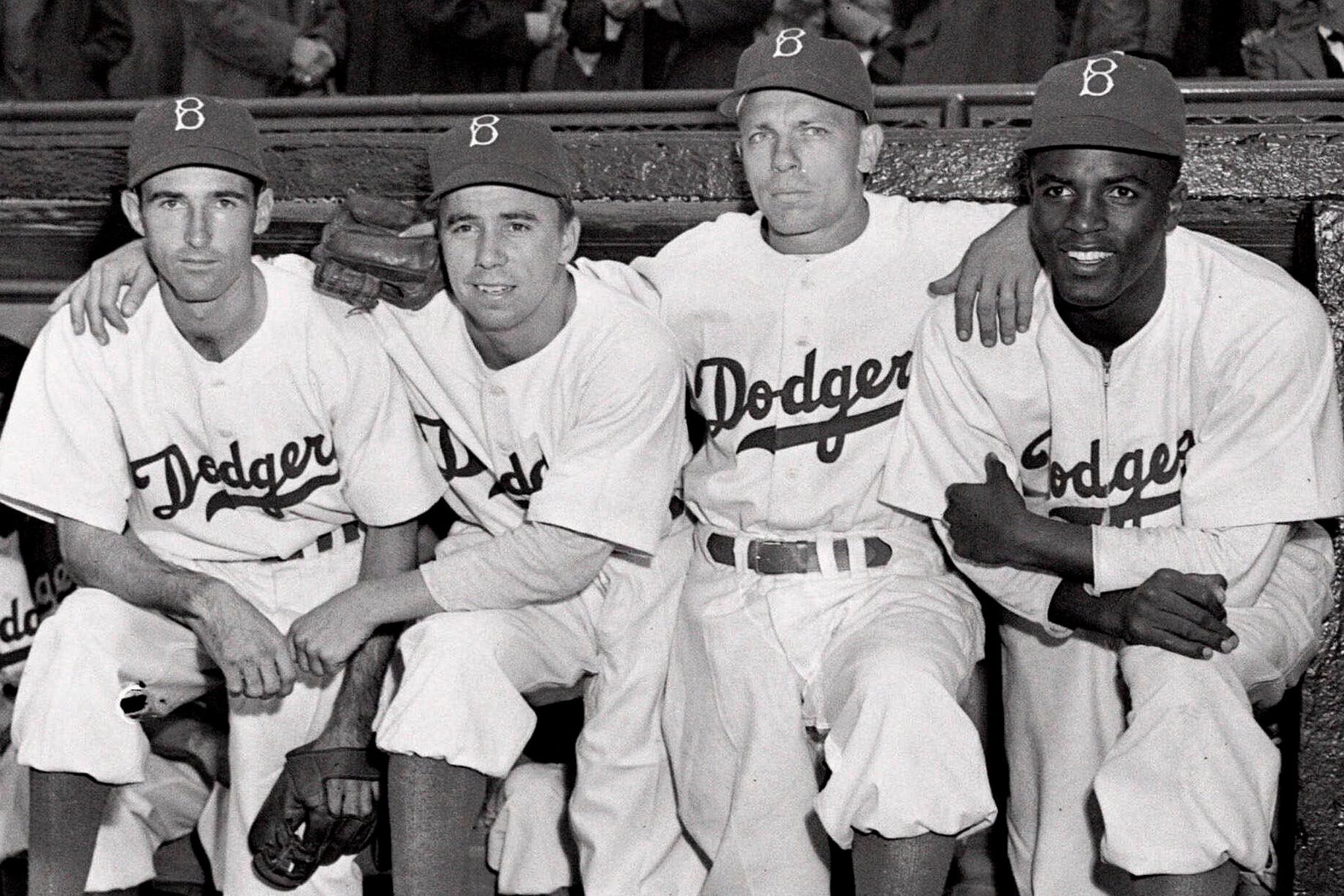 FILE – From left, Brooklyn Dodgers third baseman John Jorgensen,...