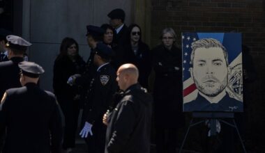 NYPD Officer Jonathan Diller's painting is seen during his funeral service in Massapequa Park on Saturday, March 30, 2024. (AP Photo/Jeenah Moon)