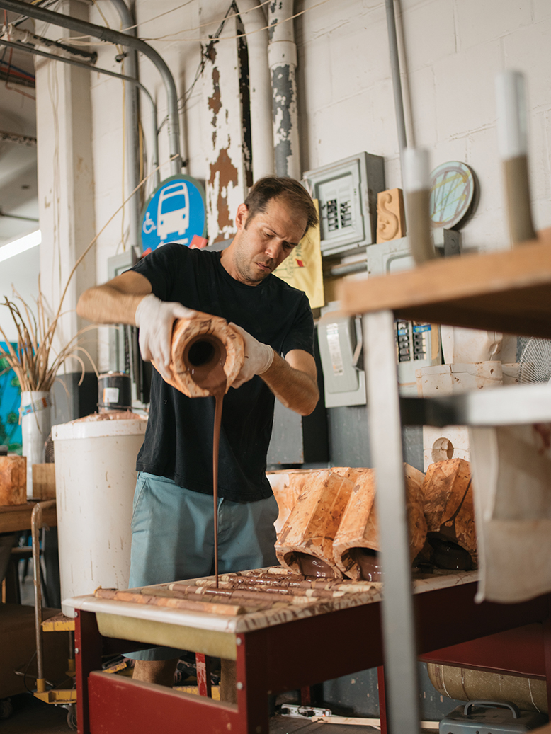 Jono Pandolfi, whose tableware appears on Hulu's "The Bear," works on a piece at his studio in Union City, NJ