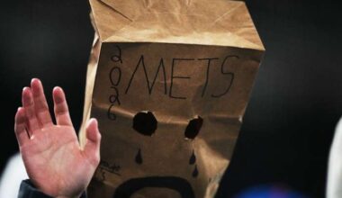 Mets fans mostly stay home but fill Citi Field with late boos as New York's skid hits 12 games