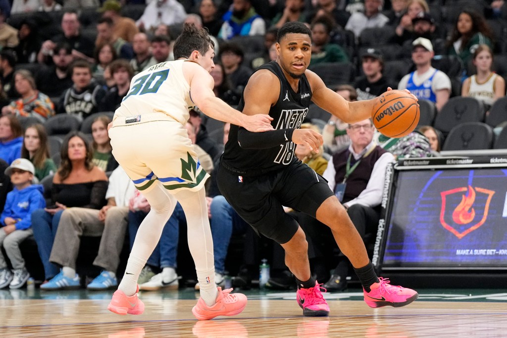 Brooklyn Nets guard Malachi Smith (18) drives towards the basket against Milwaukee Bucks guard Cormac Ryan (30) during the third quarter at Fiserv Forum.