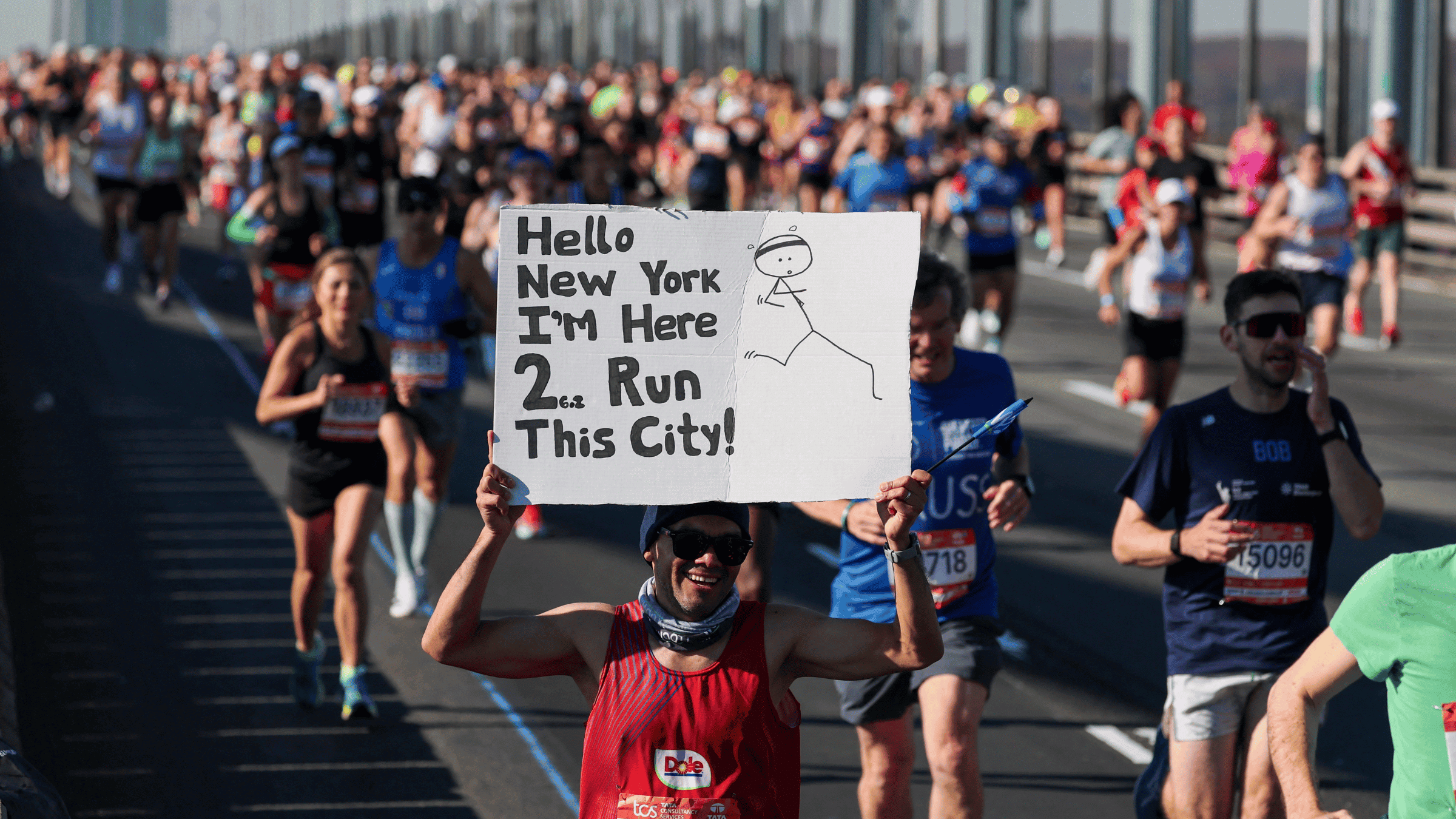Runners cross the Verrazano Bridge as they compete in the New York Marathon in New York on November 2, 2025.