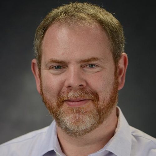 A headshot of Dr. Nigel Raine