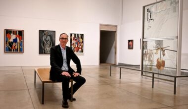 Philadelphia Museum of Art curator Matthew Affron in the Duchamp gallery on March 4, 2026. Marcel Duchamp’s “The Bride Stripped Bare by Her Bachelors, Even (The Large Glass),” is at right.