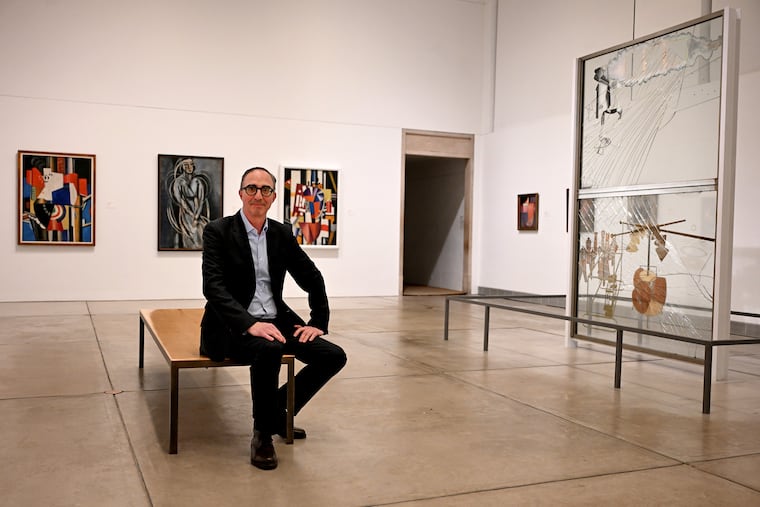 Philadelphia Museum of Art curator Matthew Affron in the Duchamp gallery on March 4, 2026. Marcel Duchamp’s “The Bride Stripped Bare by Her Bachelors, Even (The Large Glass),” is at right.