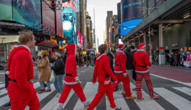 FILE - Revelers take part in SantaCon, Dec. 14, 2024, in New York. (AP Photo/Julia Demaree Nikhinso...