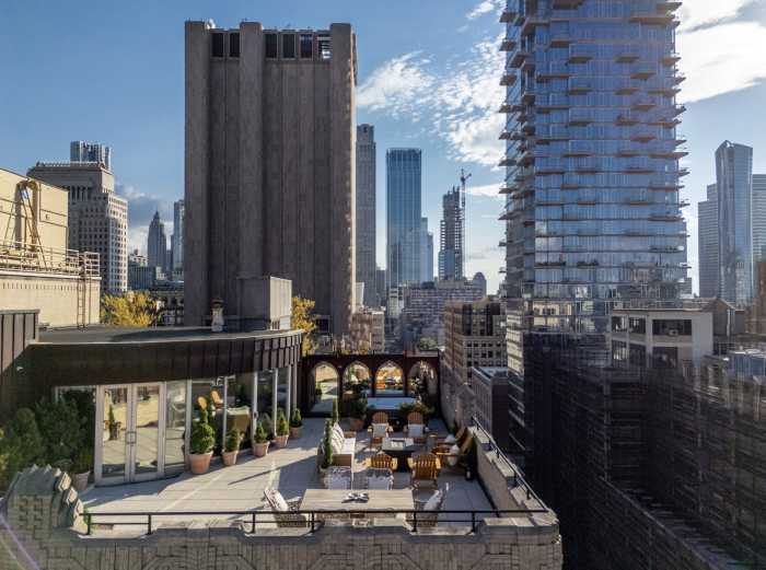 outside private area of an apartment surrounded by buildings
