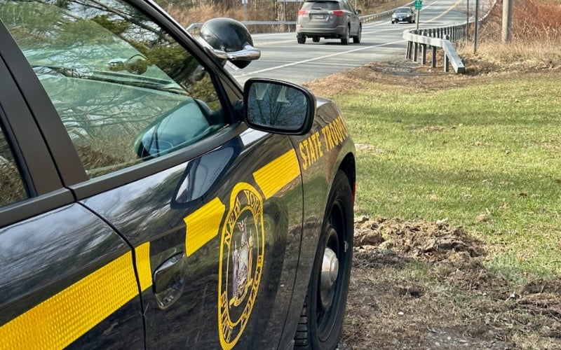 NY State Trooper vehicle parked on the shoulder of a road in the Finger Lakes region.