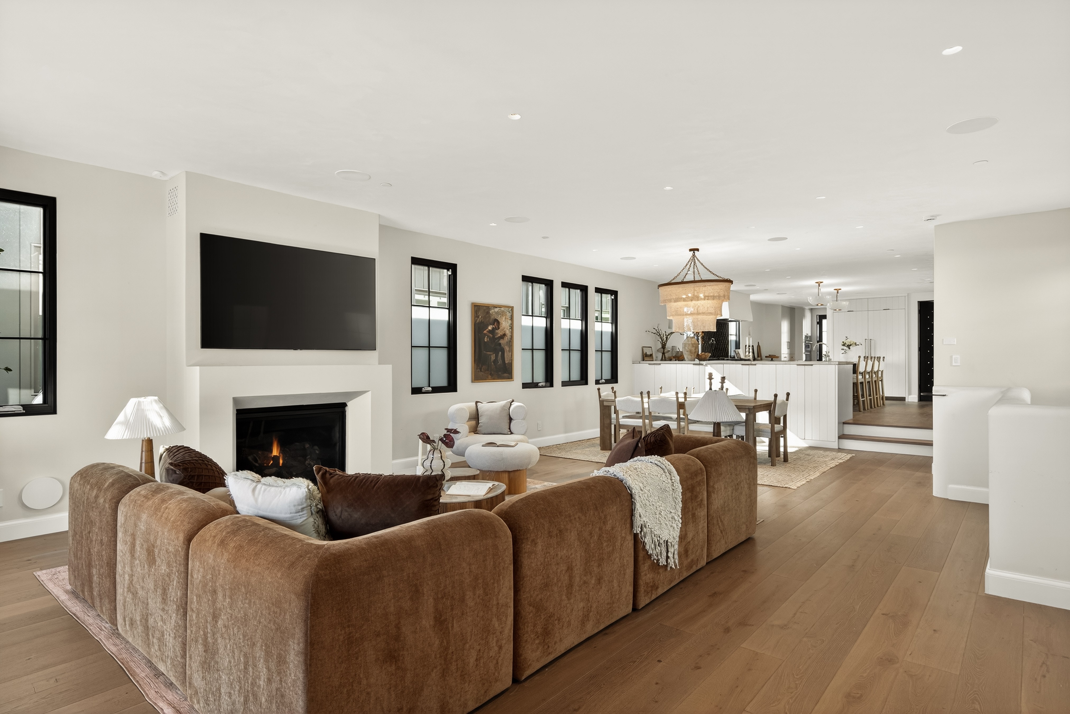 The open-plan living space merges the kitchen with the dining...