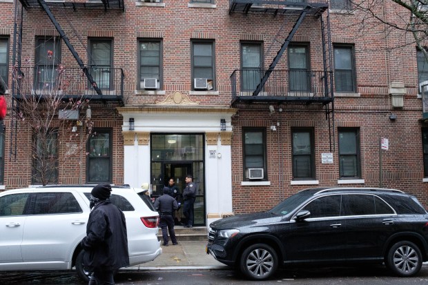Police investigate after Basilisa Negron was found shot to death inside 115 W. 141st St. in Manhattan, New York on Tuesday, December 23, 2025. (Gardiner Anderson / New York Daily News)