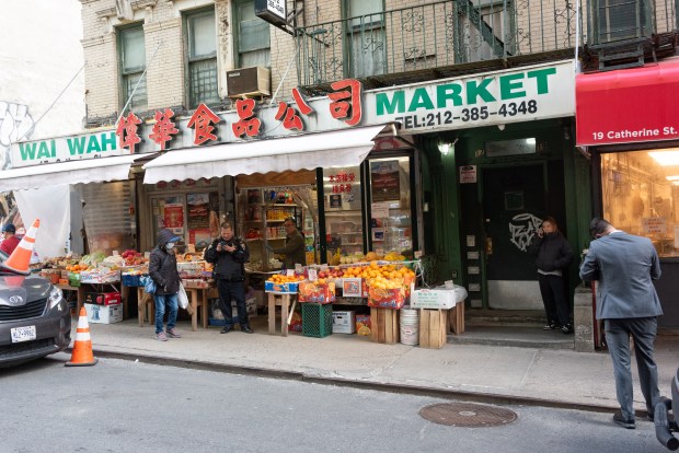Police investigate a stabbing inside a grocery store at 17 Catherine St. in Chinatown, Manhattan, New York on Tuesday, April 7, 2026. (Gardiner Anderson / New York Daily News)