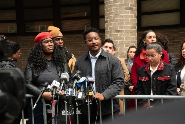 City Council member Chi Osse speaks outside the 79th Precinct stationhouse on Wednesday after being released following his arrest during an eviction protest.