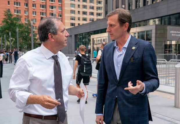 Congressman Dan Goldman (right) talks with New York City Comptroller Brad Lander before speaking at a press conference outside the Jacob K. Javits Federal Building on Tuesday, July 8, 2025 in Manhattan, New York.