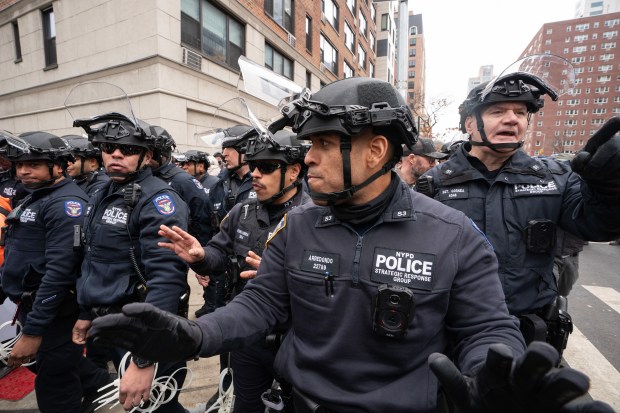 NYPD Strategic Response Group officers clear counter-demonstrators from an area near Gracie Mansion during a protest Saturday, March 7, 2026, in Manhattan, New York. (Barry Williams/ New York Daily News)