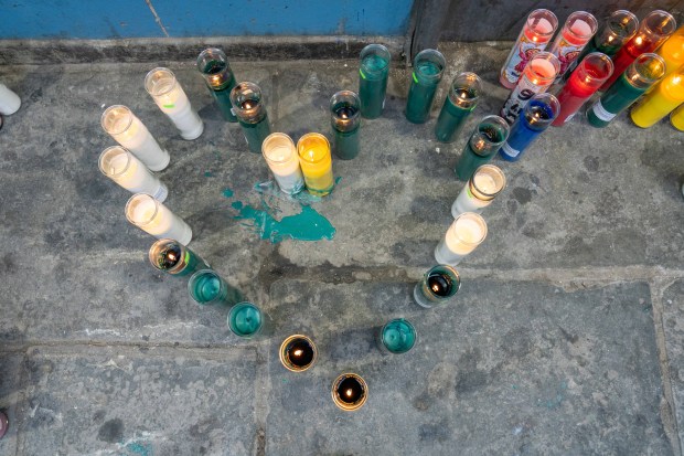 A candle memorial for Kaori Patterson-Moore is pictured outside an apartment building on Moore St. in Brooklyn on Thursday, April 2, 2026. (Theodore Parisienne / New York Daily News)