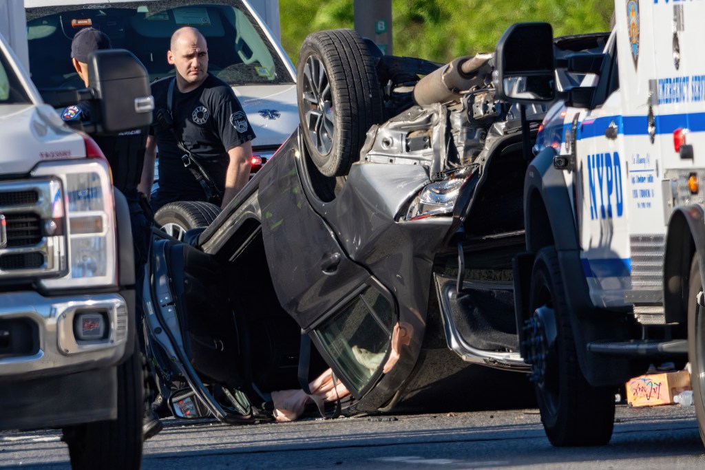 Two women hospitalized after their car crashes, overturns on BQE in Brooklyn