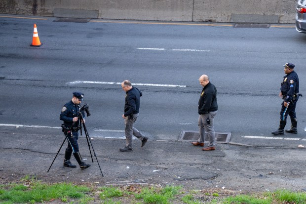 An unknown unidentified adult male, who was found lying in the westbound lanes of the Bruckner Expressway near Castle Hill Avenue with severe head and body trauma, was pronounced dead at Jacobi Hospital, with the unknown striking vehicle fleeing the scene in the Bronx on Saturday April 4, 2026. 0728. (Theodore Parisienne / New York Daily News)