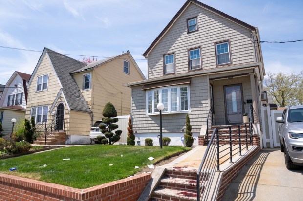 Blood is pictured on the ground after a man, allegedly enraged over a dog peeing on his lawn, stabbed multiple people on 229th St. near 141st Ave. in Queens on Thursday, April 23, 2026. (Theodore Parisienne / New York Daily News)