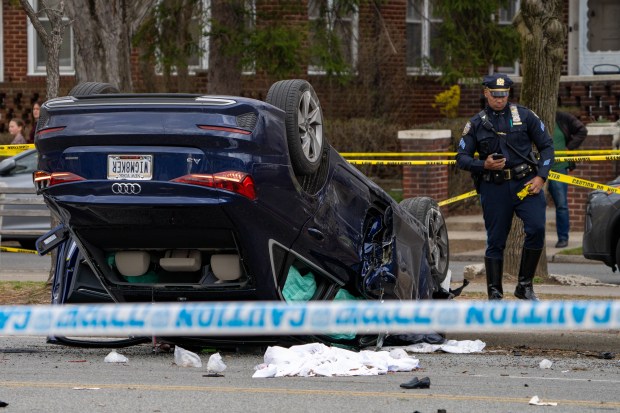 Three people an adult and two children were killed Saturday, March 29, 2025, after a blue Audi collided with a silver Toyota Camry Uber and careened toward a small group walking on Ocean Pkwy. near Quentin Rd. in Brooklyn. (Theodore Parisienne / New York Daily News)