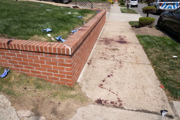 Blood is pictured after a man, allegedly enraged over a dog peeing on his lawn, stabbed multiple people on 229th St. near 141st Ave. in Queens on Thursday, April 23, 2026. (Theodore Parisienne / New York Daily News)