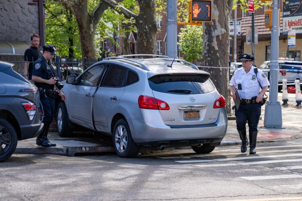 An 80-year-old man and an 87-year-old woman were struck by the driver of a 2013 Nissan while in the crosswalk at 35th Ave. and Crescent St. in Queens on Friday, April 17, 2026. (Theodore Parisienne / New York Daily News)