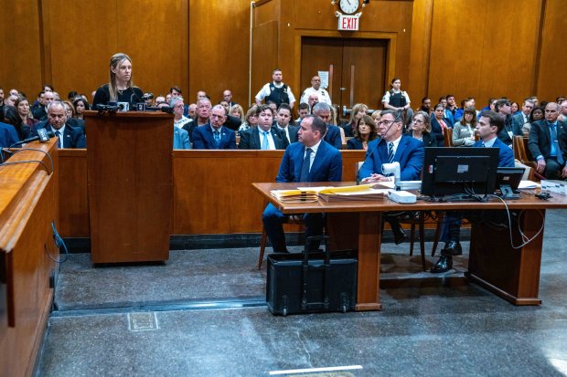 Stephanie Diller, left, widow of NYPD Detective Jonathan Diller, addresses the court prior to the sentencing of Guy Rivera at Queens Criminal Court in Queens on Monday, April 27, 2026.