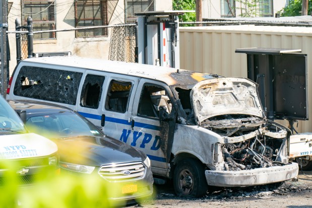 Multiple NYPD vehicles were burnt after an arsonist set them on fire whilst they were parked in a parking lot bounded by Central Avenue and Dekalb Avenue in Brooklyn on Thursday June 12, 2025. 0851. (Theodore Parisienne / New York Daily News)