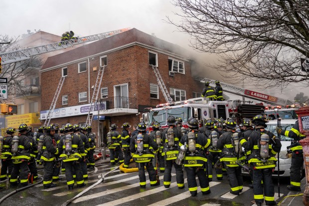 Three people were killed, including a child of unknown age, with several others suffering serious injuries, after a four-alarm fire broke out inside a two story residence at 44-49 College Point Boulevard in Queens on Monday March 16, 2026. 1309. (Theodore Parisienne / New York Daily News)