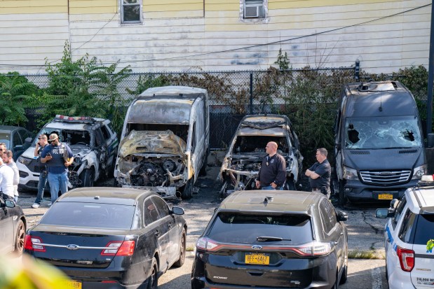 Multiple NYPD vehicles were burnt after an arsonist set them on fire whilst they were parked in a parking lot bounded by Central Avenue and Dekalb Avenue in Brooklyn on Thursday June 12, 2025. 0851. (Theodore Parisienne / New York Daily News)