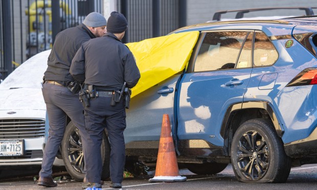 Police investigate after a 55-year-old man was found dead in a livery car on Morris Avenue in the Bronx Thursday morning after being shot in the head.