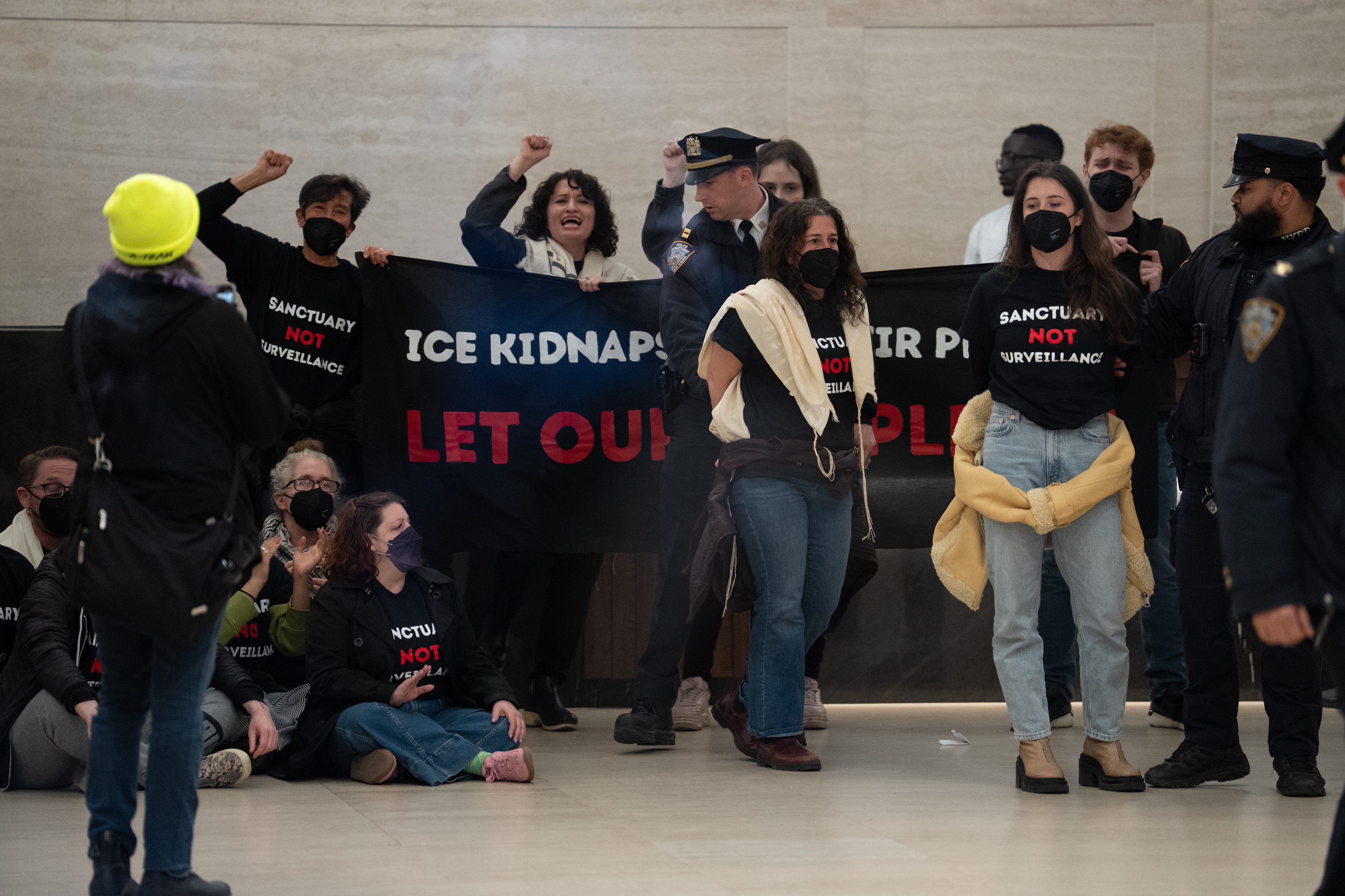 Protestors are arrested for occupying the lobby of Palantir Technologyâs...