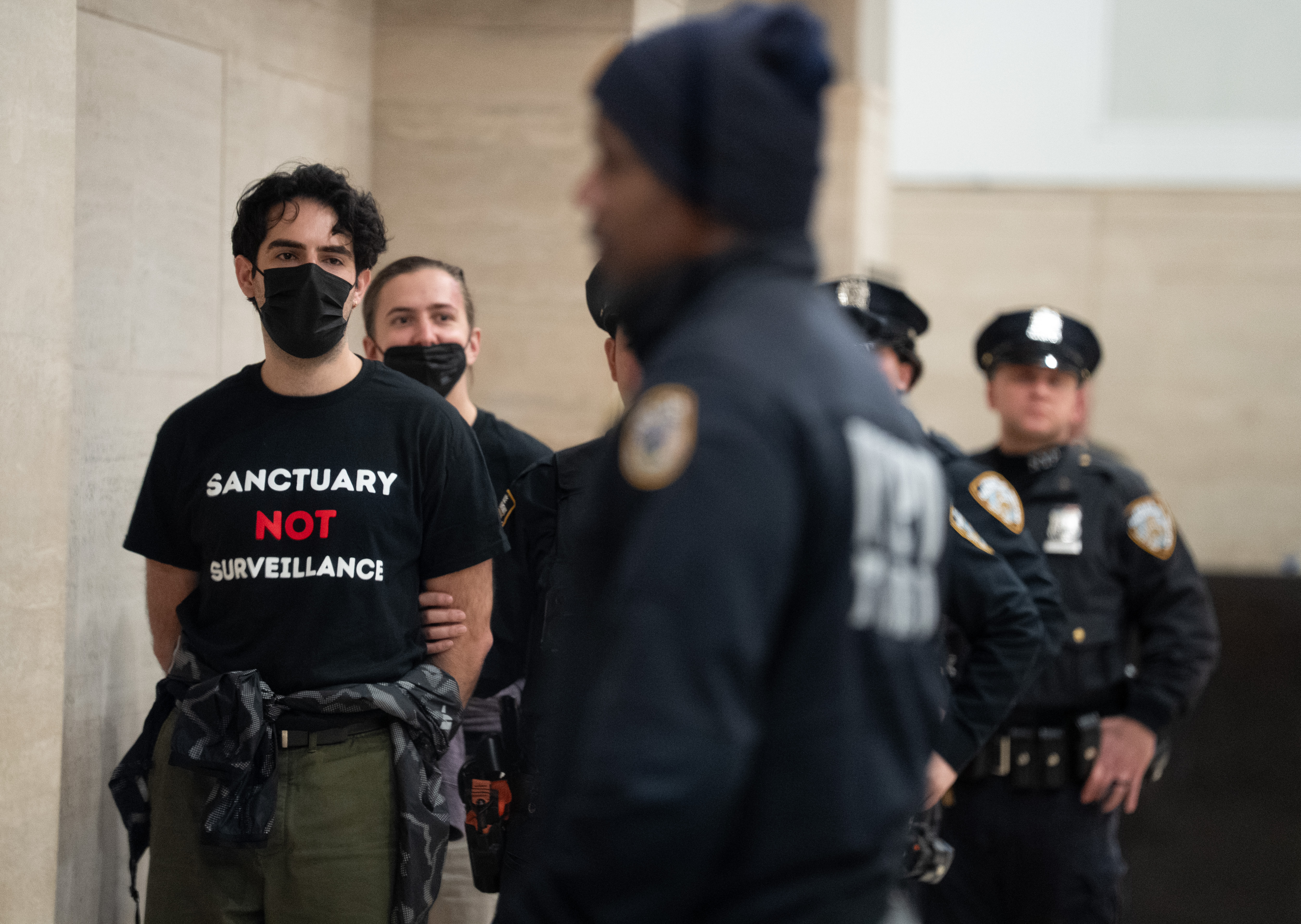 Protestors are arrested for occupying the lobby of Palantir Technologyâs...