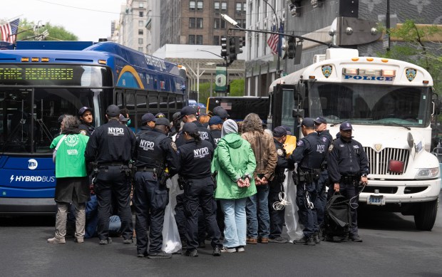 Climate activists from Extinction Rebellion are arrested for blocking Fifth Ave. outside Trump Tower in Manhattan during a protest Wednesday, April 22, 2026. (Barry Williams/ New York Daily News)