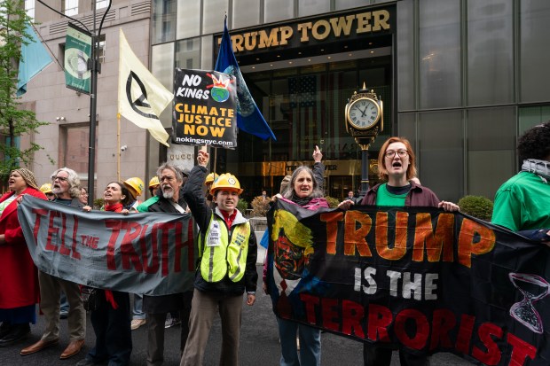 Climate activists from Extinction Rebellion protest outside Trump Tower on Wednesday, April 22, 2026, in Manhattan, New York. (Barry Williams/ New York Daily News)