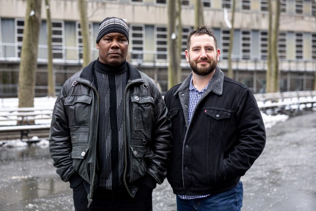 Carl Miller, left, is fighting to get his murder conviction vacated, with his attorney James Henning, right, at Columbus Park in Brooklyn, Wednesday, Feb. 12, 2025. (Shawn Inglima/New York Daily News)