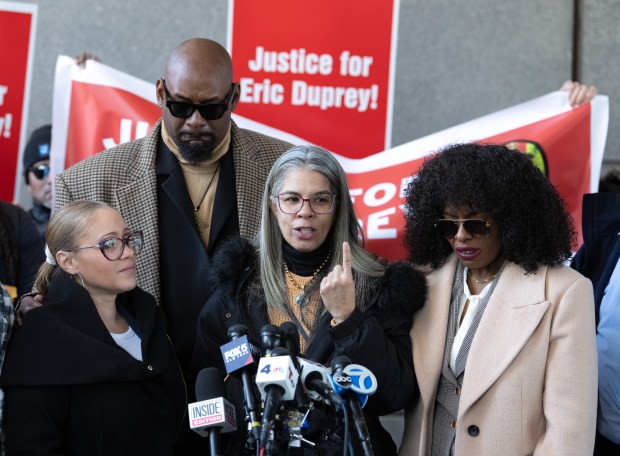 Eric Duprey's mother, Gretchen Soto, speaks alongside BLM NYC co-founders Hawk Newsome and Chivona Newsome after NYPD Sgt. Erik Duran's sentencing on April 9 in the Bronx. 