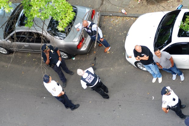Police secure the scene on Aqueduct Ave. at W. 190th St. in the Bronx on Wednesday, Aug. 23, 2023. Eric Duprey, a scooter-riding suspect fleeing a Bronx buy-and-bust drug sting, was killed on Wednesday, Aug. 23, 2023, when an NYPD sergeant grabbed a cooler from a nearby family get-together and hurled it at the man, knocking him to the ground, an eyewitness and police sources said. (Sam Costanza for New York Daily News)