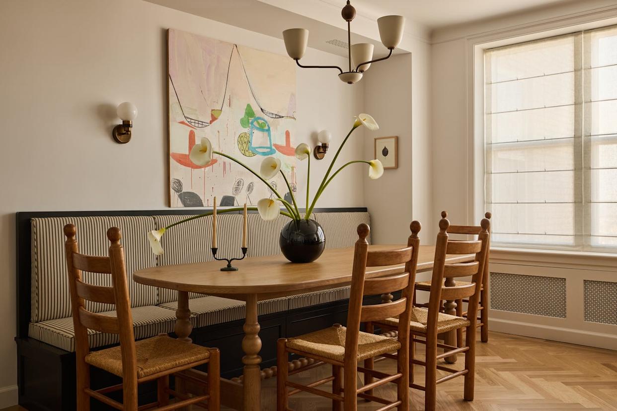 Dining area featuring a table, chairs, and decorative elements.