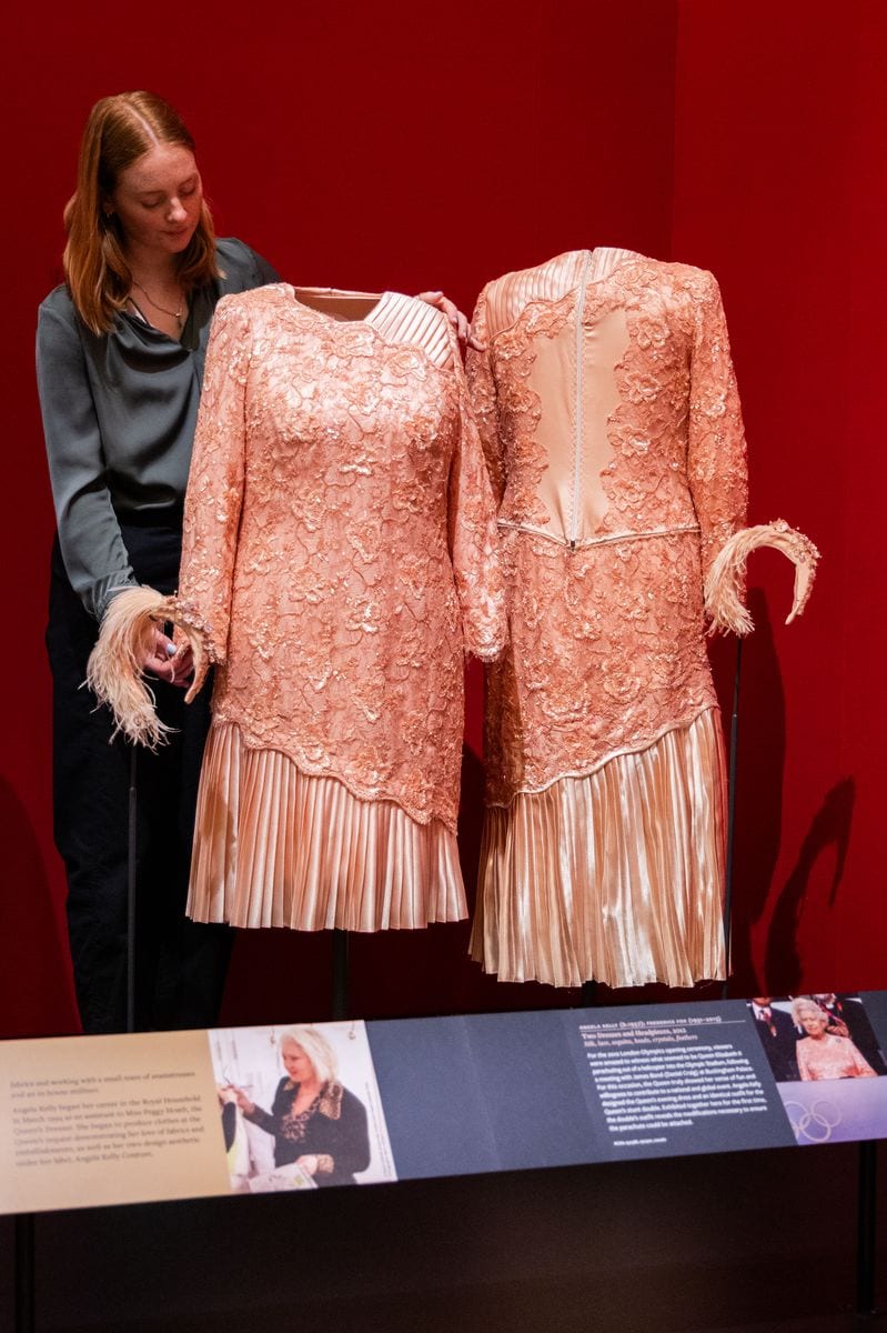  A peach cocktail dress designed by Angela Kelly, worn by Queen Elizabeth II during the 2012 London Olympic Games opening ceremony.