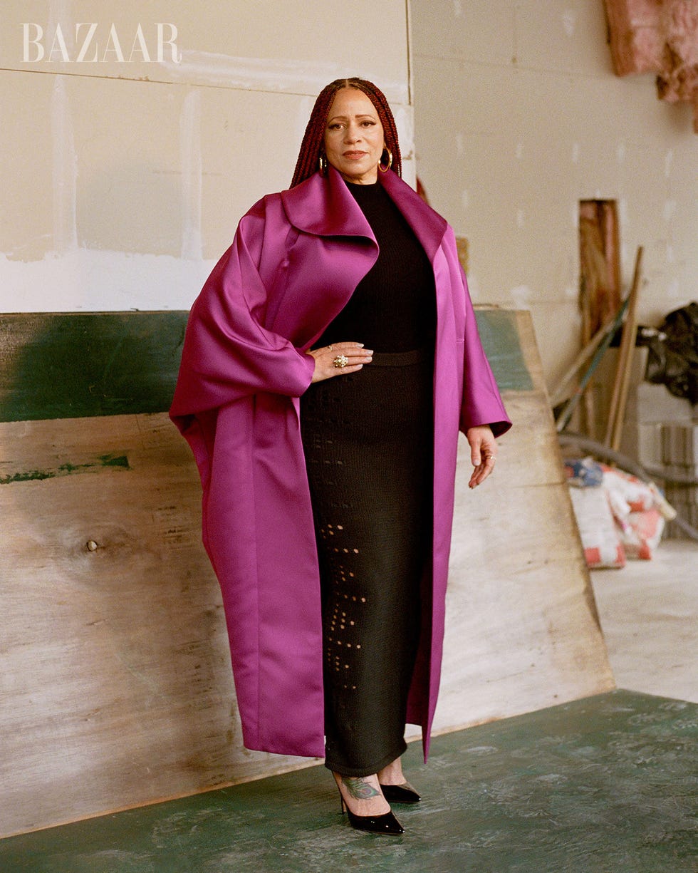 Fashion model in a striking outfit showcasing bold colors.