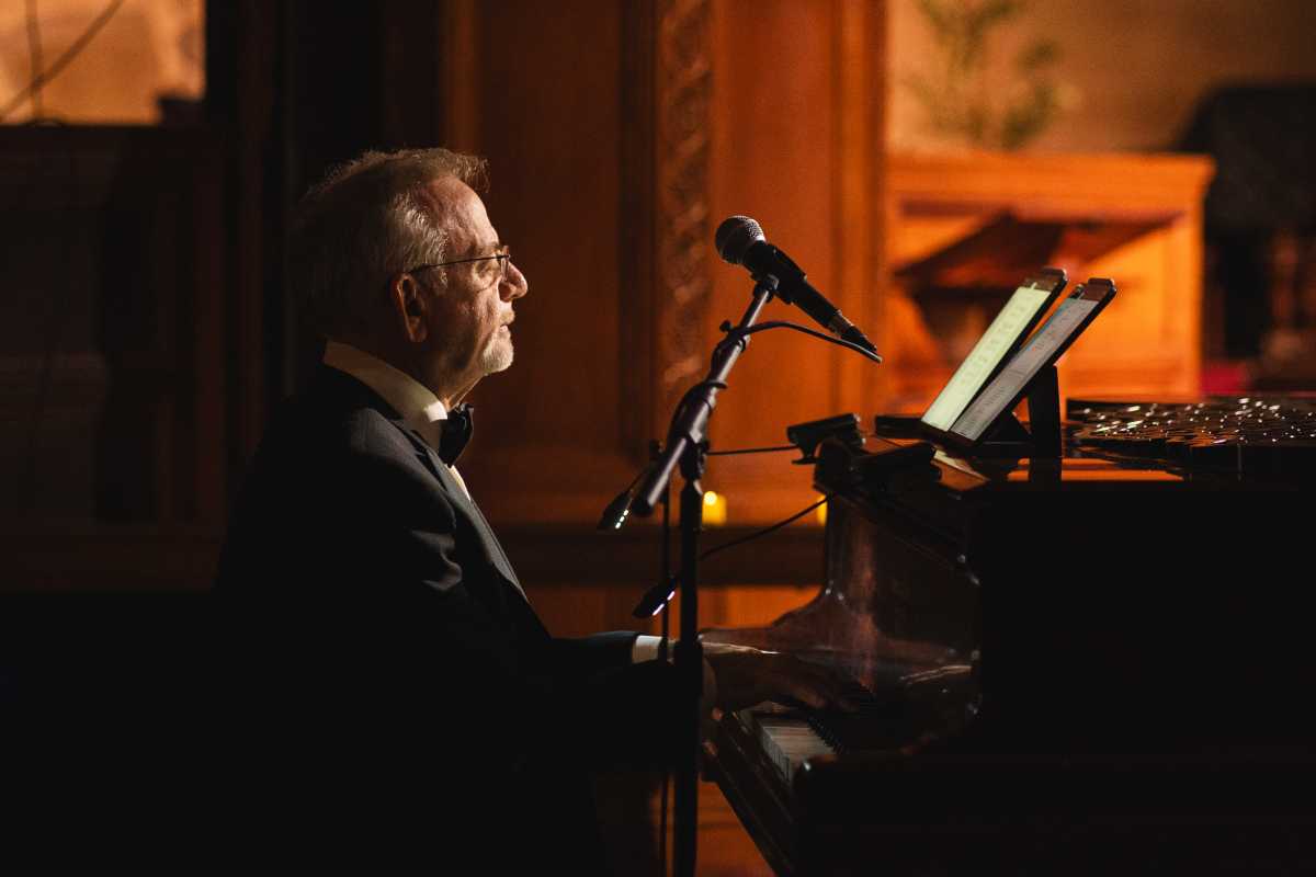 Marc Shaiman playing the piano