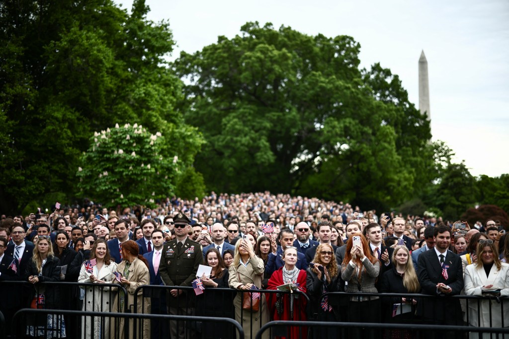 Attendees watch the arrival ceremony.