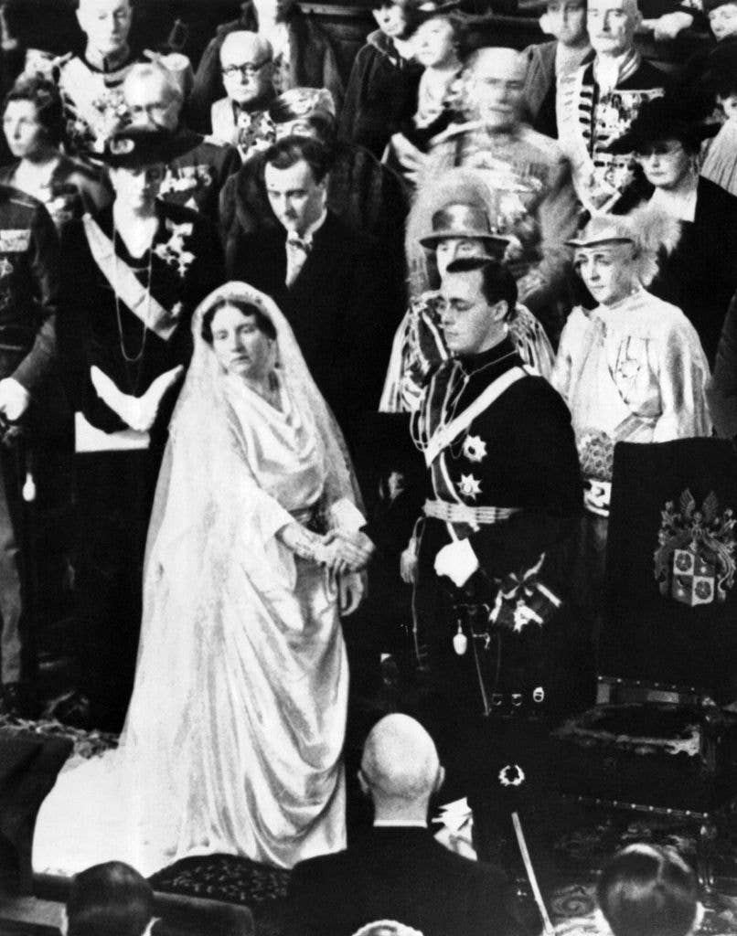 Princess Juliana and Prince Bernhard holding hands at their wedding in 1937